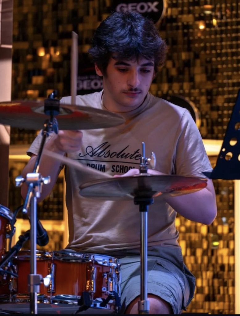 Guy from absolute Musico playing drum